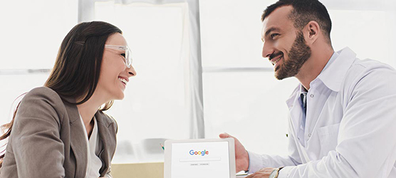 Two people talking across a desk